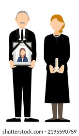 Senior couple standing with their daughter's portrait and temporary tablets