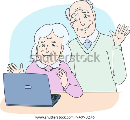 Senior couple using computer at home