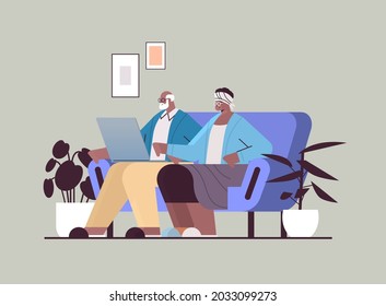 senior couple using laptop grandparents relaxing at home social media network online communication concept