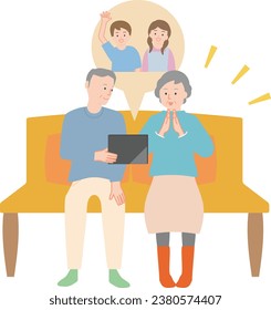 Senior couple watching videos of their grandchildren on a tablet