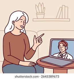 Senior Dark skinned woman with curly hair wears headphones and waves while communicating remotely via laptop in online meeting