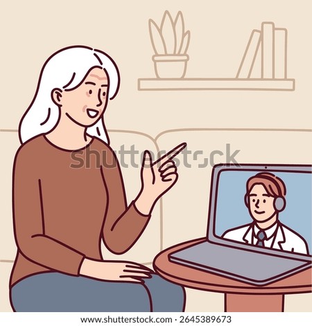 Senior Dark skinned woman with curly hair wears headphones and waves while communicating remotely via laptop in online meeting