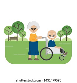 Senior Elderly couple in the park. Old woman carries an elderly man in a wheelchair.