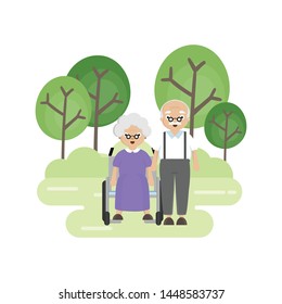 Senior Elderly couple in the park. Old man carries an old woman in a wheelchair.