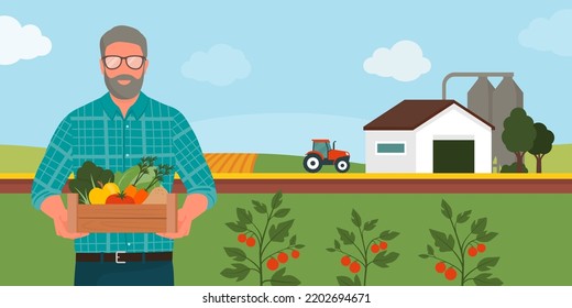 Senior farmer holding a crate with fresh organic vegetables and fruits, farm in the background: sustainable organic agriculture and local produce concept