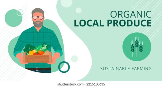 Senior farmer holding a crate with fresh organic vegetables and fruits: sustainable organic agriculture and local produce concept, banner with copy space