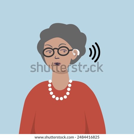 Senior lady using hearing aid.