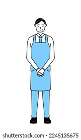 A senior man in an apron bowing with folded hands.