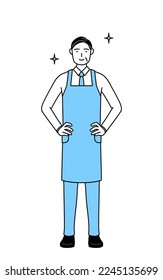 A senior man in an apron with his hands on his hips.