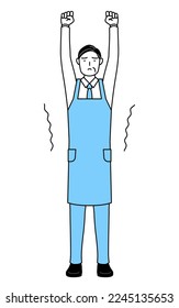 A senior man in an apron stretching and standing tall.