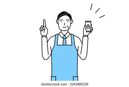 A senior man in an apron taking security measures for his phone.