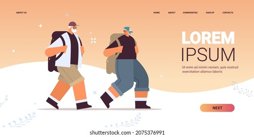 senior man woman hikers traveling together with backpacks active old age physical activities concept