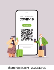 senior travelers using digital immunity passport with qr code on smartphone screen risk free covid-19 pandemic