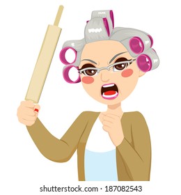 Senior woman angry holding roll pin with aggressive expression screaming