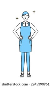 A senior woman in an apron with his hands on his hips.