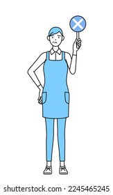A senior woman in an apron holding a bar of buts indicating incorrect answers.