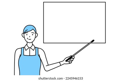 A senior woman in an apron pointing at a whiteboard with an indicator stick.