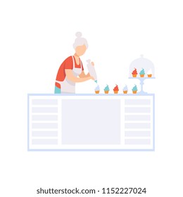 Senior woman character baking cupcakes in the kitchen, elderly people leading an active lifestyle social concept vector Illustration on a white background