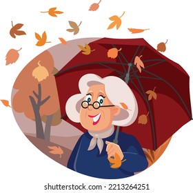 
Senior Woman Holding An Umbrella In Autumn Season Vector Illustration. Cheerful Elderly Lady Enjoying Fall Season And Cold Weather
