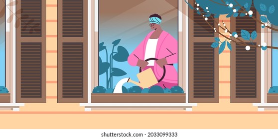 senior woman holding watering can and pouring plants home gardening old age concept