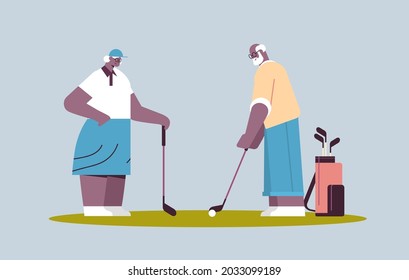 senior woman man couple playing golf aged african american family players taking a shot active old age