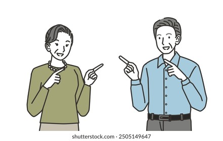 Senior woman and senior man pointing to the side
