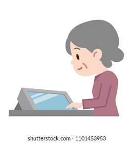 Senior woman operating a monitor