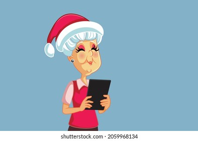 Senior Woman Shopping Online for Christmas Vector Cartoon. Elderly person holding a computer tablet ready for holidays 
