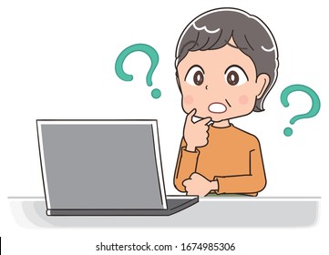 Senior woman with short hair wearing orange clothes.She uses a personal computer.