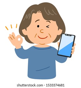 Senior woman showing OK hand sign with smartphone