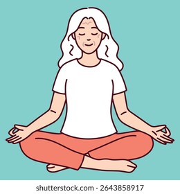 Senior woman sits calmly in lotus position with closed eyes, focusing on breathing and mindfulness as part of daily yoga or wellness routine