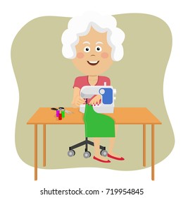Senior woman stitching fabric using a sewing machine
