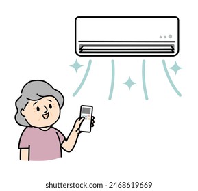 Senior woman using air conditioner.