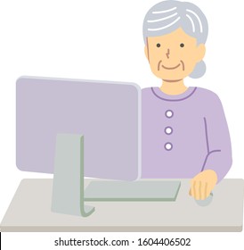 Senior woman using a computer wearing purple