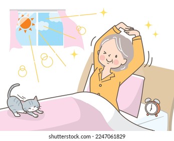 Senior woman waking up refreshed in the morning and stretching with cat