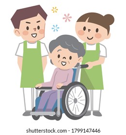 Senior woman in wheelchair and nursing staff