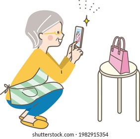 Senior women shooting products for sale on flea market apps on their smartphones