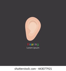 Senses.  The image of the ear on a dark background. Logo design hearing. Vector illustration.