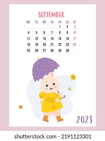 September 2023 calendar. Cute bunny under an umbrella, in raincoat and rubber boots with falling autumn leaves. Vector illustration. Vertical Template. Week from Monday. English. rabbit symbol year.