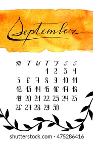 September calendar with bright orange background and hand-written calligraphy and decoration