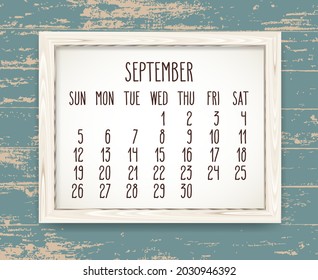September year 2021 vector monthly calendar. Week starting from Sunday. Hand drawn text in a wooden frame over rustic distressed teal wood background.