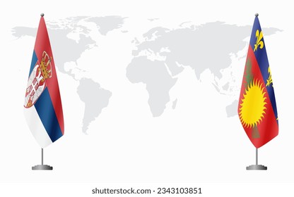 Serbia and Guadeloupe flags for official meeting against background of world map.