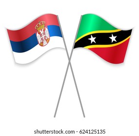 Serbian and Kittitian crossed flags. Serbia combined with Saint Kitts and Nevis isolated on white. Language learning, international business or travel concept.