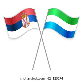 Serbian and Sierra Leonean crossed flags. Serbia combined with Sierra Leone isolated on white. Language learning, international business or travel concept.