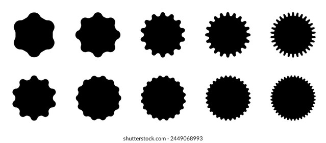 A series of black ink blots with different edge designs on a white background, suitable for creative backgrounds or patterns.