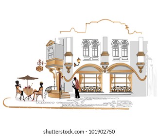 Series of street cafes with people drinking coffee in the old city