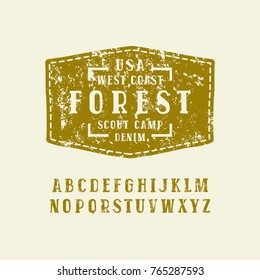 Serif font in the style of handmade graphics. Letters with rough texture. Patch with camping emblem. Green print on light background