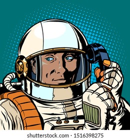 serious astronaut talking on a retro phone. Pop art retro vector illustration drawing