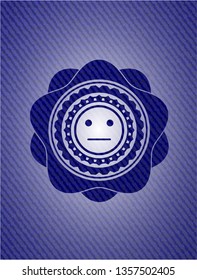 serious face icon with denim texture