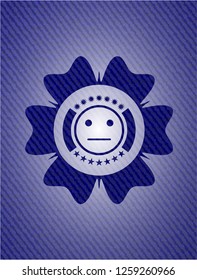 serious face icon inside badge with denim background